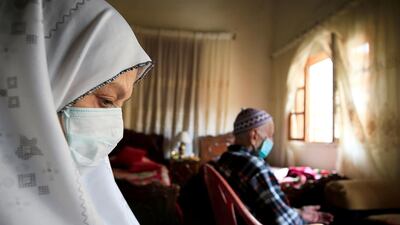 Ahmad al-Asmar, 84, and his wife Nouzat Awada, 79, perform Friday prayers inside their home as mosques are closed over concerns of the spread of coronavirus disease (COVID-19) in Sidon, Lebanon. Reuters