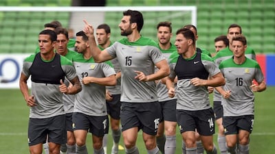 Mile Jedinak leads Australia on a team jog during a training session on Thursday ahead of their Friday opener against Kuwait to the 2015 Asian Cup in Melbourne. William West / AFP / January 8, 2015