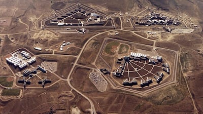 FILE - This Feb. 11, 2004, file photo provided by the Bureau of Prisons shows the Federal Correctional Complex in Florence, Colo. Clockwise from lower left is the minimum security Federal Prison Camp, the high security United States Penitentiary, the maximum security United States Penitentiary and the Federal Correctional Institution. Experts say the drug lord Joaquin "El Chapo" Guzman, who will be sentenced on June 25, 2019 for smuggling enormous amounts of narcotics into the U.S and having a hand in dozens of murders, seems the ideal candidate for the federal government's maximum security, "Supermax," prison, also known as ADX for "administrative maximum," a facility so secure, so remote and so austere that it has been called the "Alcatraz of the Rockies.". (Bureau of Prisons via The Gazette via AP, File)
