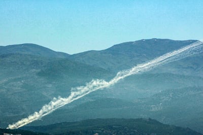 Rockets leave smoke trails behind as they are launched from southern Lebanon towards Israel on Thursday. AFP