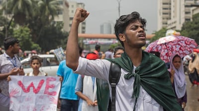 Bangladeshi student shout slogans to join their 'Safe roads movement' during a rally demanding safe roads on the seventh consecutive day of protests, in Dhaka city, Bangladesh. EPA / MONIRUL ALAM