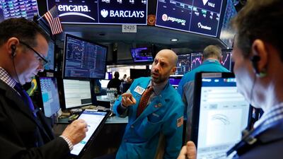 Traders on the floor of the New York Stock Exchange on Wall Street last week. Fourth quarter earnings are predicted to be marginally lower year-on-year when earnings season begins this week. AP Photo