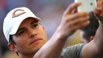 Actor Ashton Kutcher takes a selfie prior to the game. Getty Images