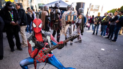 An attendee dressed as a punk rock Spider-Man poses during New York Comic Con. AP