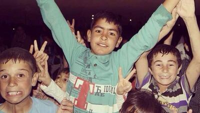 As the film came to an end, the children began to get restless. Photo courtesy Huzan N Balayi