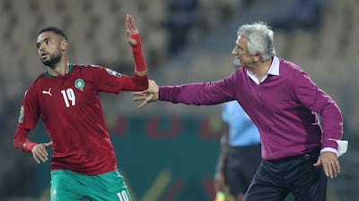 Morocco's Bosnian head coach Vahid Halilhodzic chats with Morocco's forward Youssef En-Nesyri. AFP