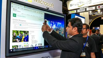 Above, the Microsoft stand which showcases face recognition software. Victor Besa for The NationalBusiness