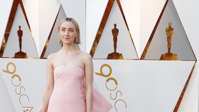 NEUTRAL TONES: Saoirse Ronan went for a palest pink sheath dress, with a large bow on the back, that perfectly suited her pale colouring. EPA