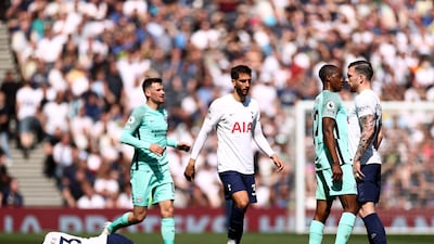 Brighton's Enock Mwepu and Tottenham's Pierre-Emile Hojbjerg clash as Ben Davies lies injured. Getty