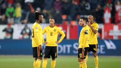 Belgium's Eden Hazard, Dedryck Boyata and teammates look dejected after conceding their fifth goal scored by Switzerland's Haris Seferovic. Reuters