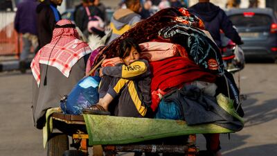 Palestinians flee their homes in Khan Younis in the southern Gaza Strip after a temporary truce between Hamas and Israel expired. Reuters