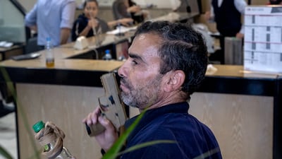 Ali Sahli demands the money from his bank account at a Credit Libanaise branch in Hazmieh, Beirut, last year. Matt Kynaston / The National