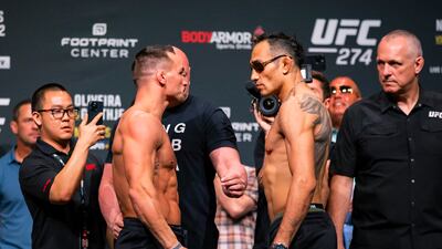 Michael Chandler faces off with Tony Ferguson during the weigh-in for UFC 274. Reuters