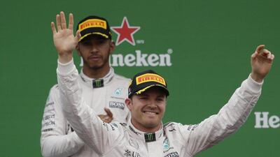 Mercedes’ Nico Rosberg celebrates his win on the podium after the Formula One Italian Grand Prix as Lewis Hamilton looks on. Max Rossi / Reuters