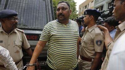 An Indian man convicted for the 2002 Gujarat riots is brought to court in Ahmadabad, India. Eleven people were sentenced to life in prison for murder in one of the many deadly religious riots that swept across the western state in 2002, leaving more than 1,000 dead. Ajit Solanki / AP Photo