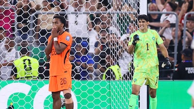 Netherlands' Quinten Timber looks dejected as Morocco goalkeeper Yassine Bounou saves the penalty. Reuters
