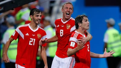 Russia's Mario Fernandes celebrates with his teammates after scoring his side's second goal. Manu Fernandez/AP Photo