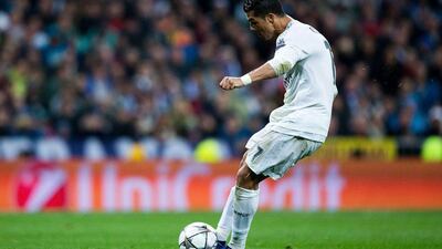 Cristiano Ronaldo of Real Madrid scores their third goal from a free kick and completes his hat trick during the Uefa Champions League quarter final second leg match between Real Madrid CF and VfL Wolfsburg at Estadio Santiago Bernabeu on April 12, 2016 in Madrid, Spain. (Photo by Gonzalo Arroyo Moreno/Getty Images)