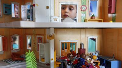 A child plays with a Playmobil house and figures at the Playmobil FunPark. Darrin Zammit / Reuters