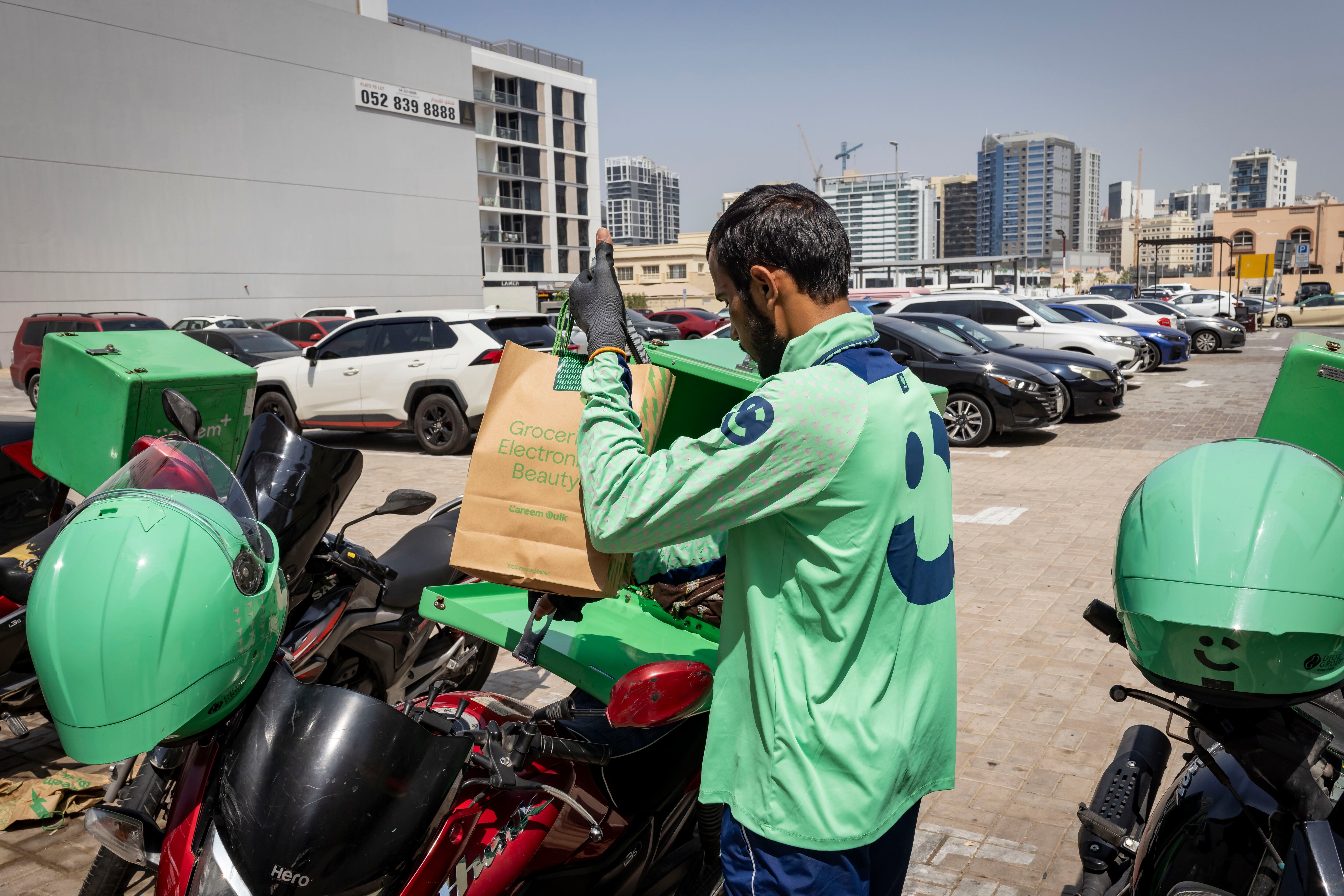 'Proud' delivery riders navigate challenges to keep show on the road ...