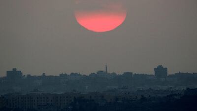 The sun sets over the northern Gaza Strip. Amir Cohen / Reuters