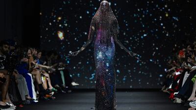 A model presents a creation by Robert Wun during the Haute-Couture Autumn/Winter show as part of Paris Fashion Week. AFP