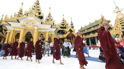 Supporters of a hard-line Buddhist monk Wirathu gather at Shwedagon Pagoda in Yangon following his arrest warrant on charge of sedition, in Yangon, Myanmar. Reuters