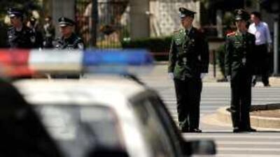 A diplomatic motorcade enters the Diaoyutai State Guesthouse in Beijing yesterday. China has not confirmed Mr Kim's visit.