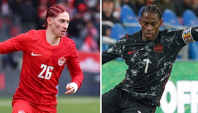 Marcelo Flores and Jonathan David of Canada. Photo: AFP