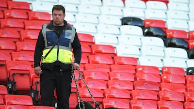 Sniffer dogs search the West Stand after fans are evacuated from the stadium before the Premier League match between Manchester United and Bournemouth at Old Trafford in Manchester, Britain, 15 May 2016. Peter Powell / EPA