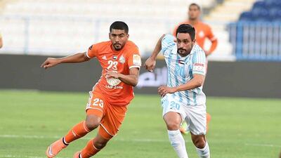 Sharjah's Hamad Ibrahim and Baniyas's Saleh Al Menhali vie for possession during their Arabian Gulf League match Friday night in Baniyas. Courtesy Arabian Gulf League