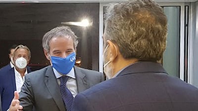 IAEA chief Rafael Grossi, second right, is welcomed by the deputy head of Iran's Atomic Energy Organisation, Behrouz Kamalvandi, upon his arrival in Tehran. AFP