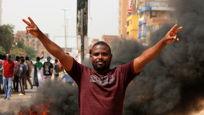 A Sudanese anti-military protester flashes the victory sign in the Sudanese capital, Khartoum. AFP
