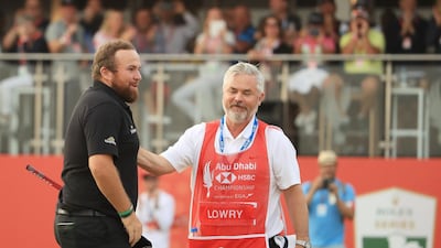 Lowry celebrates with his caddie Brian Martin.