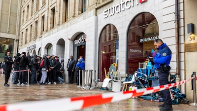 Swatch store in Geneva is cordoned off by Swiss police to avoid overcrowding as customers flock to buy the Royal Pop watch by Swatch and Audemars Piguet. EPA