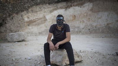 Palestinian youth seen during clashes with police in Issawia. The clashes accured one day after a terror run over by Palestinian man, killing a baby and injuring seven people in Jerusalem. Ilia Yefimovich / Getty Images