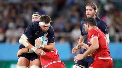 Scotland's Ryan Wilson runs at the Russian defence during the Rugby World Cup Pool A game at Shizuoka Stadium Ecopa between Scotland and Russia in Shizuoka, Japan. AP Photo