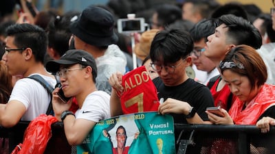 Fans react during the visit of Ronaldo. EPA