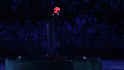 Japan’s prime minister Shinzo Abe holds a ball during the Rio 2016 Olympic Games closing ceremony. Tokyo will host the next games in 2020. Jae C Hong / AP Photo