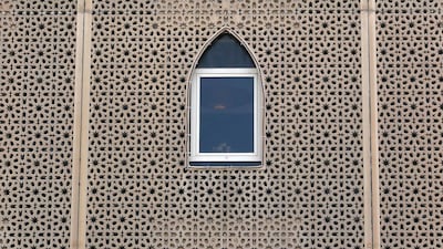 A view of a window of the Arabian Courtyard Hotel in the Al Seef area of Bur Dubai. Pawan Singh / The National