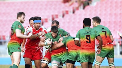 Dubai Knights Eagles take on Dubai Tigers, in red, in the West Asia Premiership at Dubai Sports City on Friday. The Tigers won 27-16.