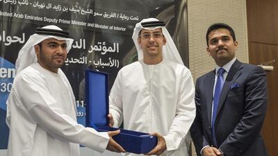 Mohammed Al Otaiba, editor-in-chief of The National, receives an award at Gulf Traffic Week in Abu Dhabi. Mona Al Marzooqi / The National