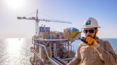 A Saudi Aramco worker at the Tanajib facility in Saudi Arabia. Dubai-based fund manager Dalma Capital suggested institutional demand could drive Saudi Aramco's valuation above $2bn after its shares begin trading on the Tadawul exchange on Wednesday. EPA