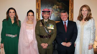 Jordan's King Abdullah; Queen Noor, widow of late King Hussein; and Queen Rania posing for a picture with Prince Hamzah, half-brother of Jordan's King Abdullah and his new wife Princess Basma Otoum in 2012. AFP, HO