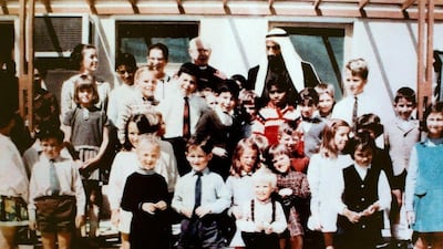 Sheikh Zayed's Visit to The British School Al Khubairat in the 1970s. Kathryn Lamb is on the far right in a blue dress. Courtesy The British School Al Khubairat