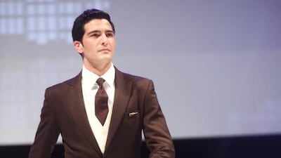 An Etihad Airways cabin crew shows off the butler uniform. For the first time ever Etihad will be offering butlers aboard the new A380 service. Lee Hoagland / The National