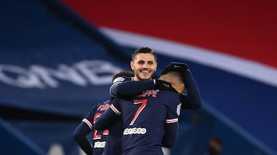 Paris Saint-Germain's French forward Kylian Mbappe celebrates with Mauro Icardi after scoring his second goal. AFP