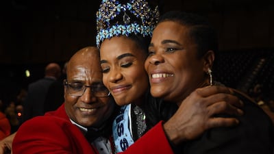 Miss World 2019 Miss Jamaica Toni-Ann Singh (C) reacts with her mother, Jahrine Bailey (R) and her father, Bradshaw Singh (L). EPA