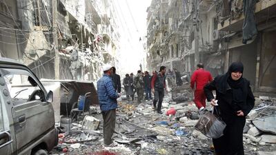 A Syrian woman cries as she leaves a residential block reportedly hit by an explosives-filled barrel dropped by a government forces helicopter on March 18, 2014, in Aleppo. Khaled Khatib / AFP
