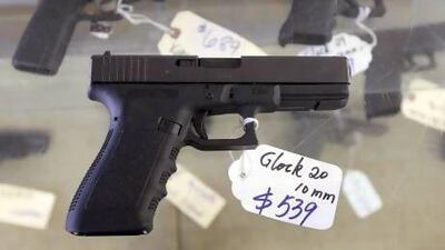 A Glock 20 10mm hand gun at the sales counter of the Guns-R-Us gun shop in Phoenix, Arizona.